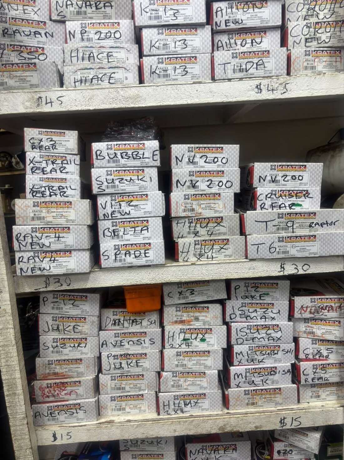 Shelves of Kratex brake pad boxes sorted by vehicle model at Righteous Motor Spares
